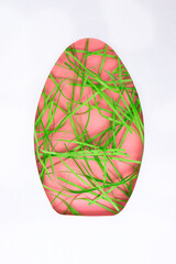 Colorful Easter egg design with pink and green grass decoration for festive celebrations during spring holiday