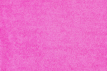 Fuchsia microfiber cloth with intricate textured loop weave that creates a soft fabric texture, ideal for wiping away dust and dirt when cleaning your home,
