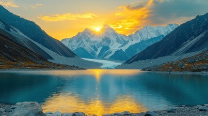 Serene mountain lake reflects sunrise, snow-capped peaks piercing sky