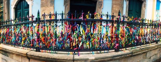 Colorful Bonfim wish ribbons tied around at Church of Nosso Senhor do Bonfim, Pelourinho, Salvador, Bahia, Brazil.