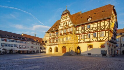 Fototapeta premium A large building with a prominent clock on the roof, great for use in urban or cityscape backgrounds