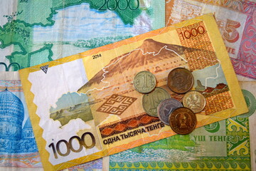 Kazakhstani tenge banknotes and coins. ₸ or KZT. Kazakhstan currency. Qazaqstan te&ntilde;gesi. Tiyin.