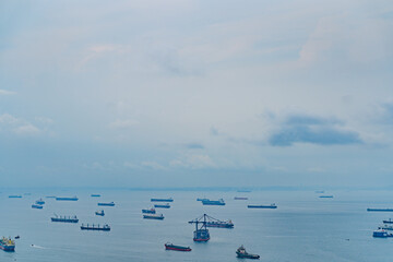 blue sky with clouds aerial view of the Bay with ships in Singapore near Gardens by the Bay