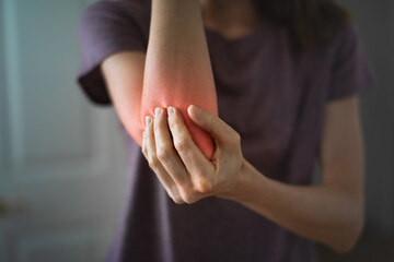 Woman with elbow joint pain
