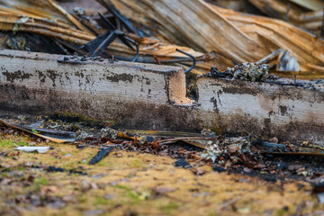 pile of twisted rusted metal debris from collapsed structure.