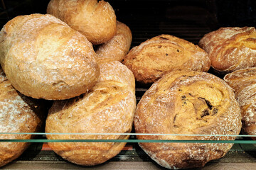 Fresh crusty bread loaves. Artisan bakery bread. Golden crispy crust. Rustic round rolls....
