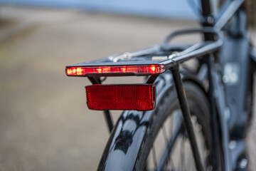 Close up view of bicycle rear light reflector.