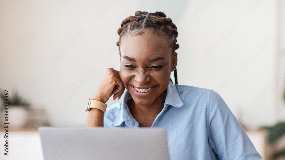 Poster good working day. smiling black female employee using laptop and drinking coffee at workplace in mod
