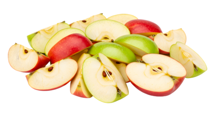 A pile of red and green apple slices with seeds on a black background