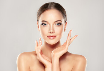 Beautiful Young Woman with Clean Fresh Skin look away .Girl beauty face care. Facial treatment . Cosmetology , beauty and spa . 