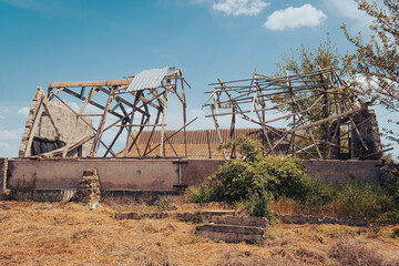 Naklejka premium Countryside. A house destroyed by shelling. War in Ukraine