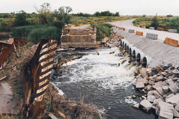 Bridge on the river, destroyed by the water flow. Catastrophe, natural disaster, flood. Destruction...