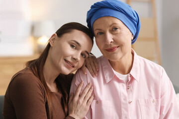 Woman with cancer and her daughter at home