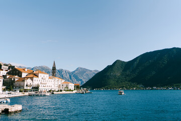 Obraz premium Boats are moored at the pier of the old town. Perast, Montenegro