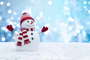 Fototapeta premium Cheerful snowman with hat and scarf in wintery scene.