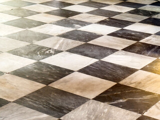 Checkered marble floor pattern with black and white tiles