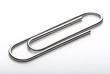  Close-Up of a Silver Paperclip on a White Background