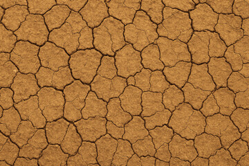 Seamless Cracked Dry Earth Texture with Natural Fracture Patterns and Arid Surface, Flat Top-Down View, Brown and Ochre Tones, Ideal for Nature, Environmental, or Climate-Themed Background Designs