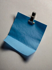 Hand-drawn blue cartoon note paper pinned with a clip for creative projects