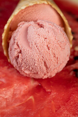 ice cream and ripe watermelon, a waffle cup with watermelon-flavored ice cream and red fresh watermelon