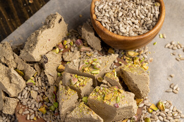 halva from sunflower seeds, close up dessert made from seeds, in a wooden bowl
