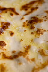 butter melts on fresh hot pancakes, cooking food using butter that melts. The melted butter flows over the pancake