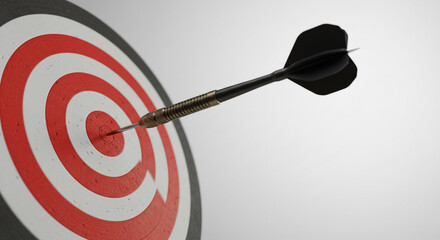 A black dart perfectly striking the bullseye of a vibrant red and white target, symbolizing unwavering focus and ultimate achievement against a simple, bright background.