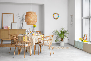 Interior of dining room with beautiful table setting for Easter celebration