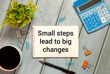 Wooden blocks with text Small steps lead to big changes