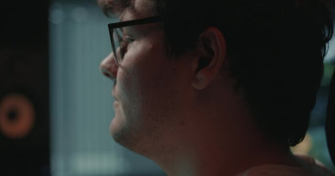 Young man editing a video in his home office 