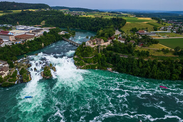 Aerial view of famous Rheinfall and colorful touristic boats in Switzerland
