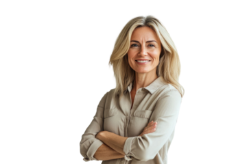 Portrait of 50 years old smiling woman looking at camera with crossed arms. Happy girl standing in creative office. Successful businesswoman standing