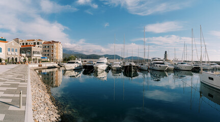 Fototapeta premium Embankment of the resort town with yachts on the pier Lustica Bay. Montenegro