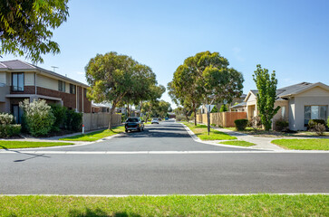 A quiet suburban street with modern houses and family homes in Melbourne, Australia. A peaceful...