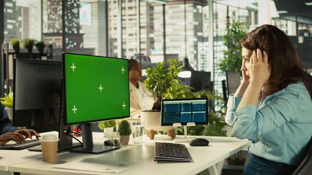 Employee at work having trouble with broken keyboard while using isolated screen PC. Office clerk in workplace unable to continue work on mockup PC because of defective computer peripherals, camera B