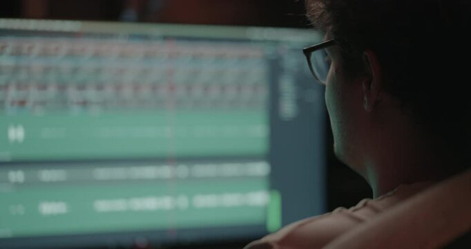 Young man editing a video in his home office 