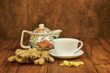 Ginger root infusion served in a teacup to combat the cold as a natural antibiotic