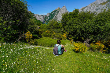 Woman sitting contemplating a beautiful landscape