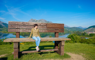 Woman on top of the highest bench in the León communi