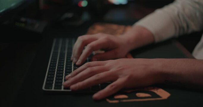 Film editor&rsquo;s Hands typing on a keyboard and mouse