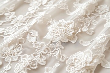 Close-up of delicate white Alenon lace fabric with floral embroidery, showcasing intricate patterns and textures.
