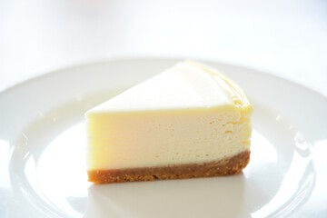 Minimalist Cheesecake Slice Presentation on White Backdrop