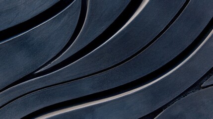 Fototapeta premium Aerial view showcases flowing, dark patterns in a rural landscape, resembling waves