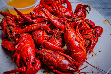 mixed spicy seafood served with butter sauce  in a white plate.