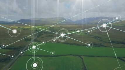 Network of connections and data processing animation over lush green landscape - Powered by Adobe