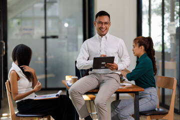 Team of confident business people point to graphs and charts to analyze market data, balance sheet, account, net profit to plan new sales strategies to increase production capacity.	
