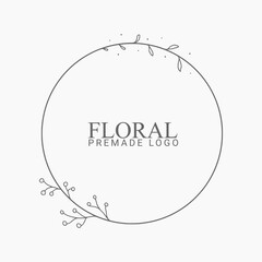 Vector floral hand drawn logo template in elegant and minimal style with black color on grey background illustration. Circle frames logos. For badges, labels, logotypes and branding business identity.