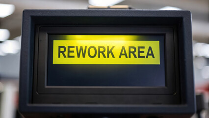 Rework area sign indicating space designated for repair tasks that are not good enough in their current state, emphasizing concept of improvement