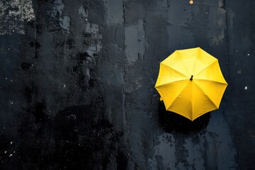 Yellow umbrella on wet asphalt, rainy day