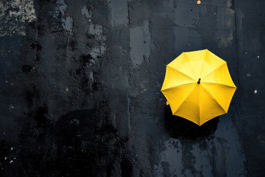 Yellow umbrella on wet asphalt, rainy day
